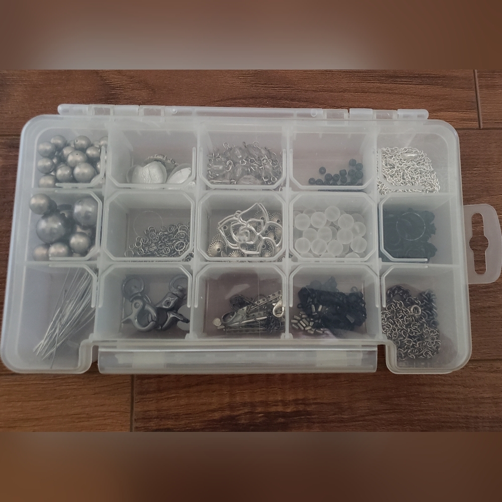 Lot of jewelry-making supplies beads in container